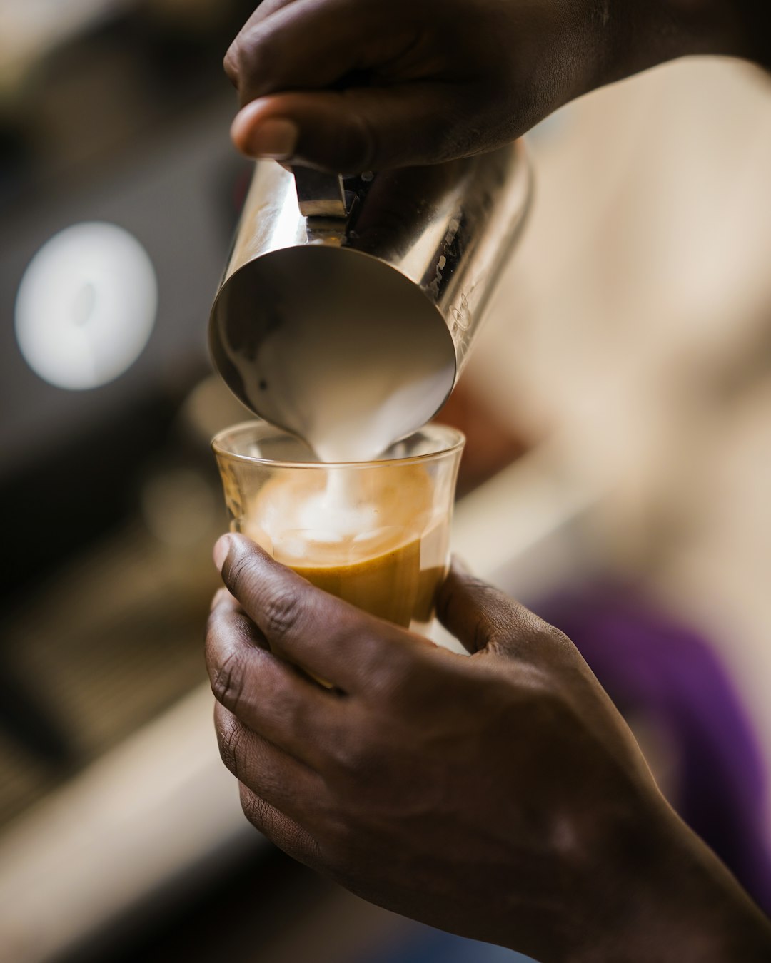 gallery-03 barista-pouring-frothed-milk-into-coffee-nauzp-e-u-u